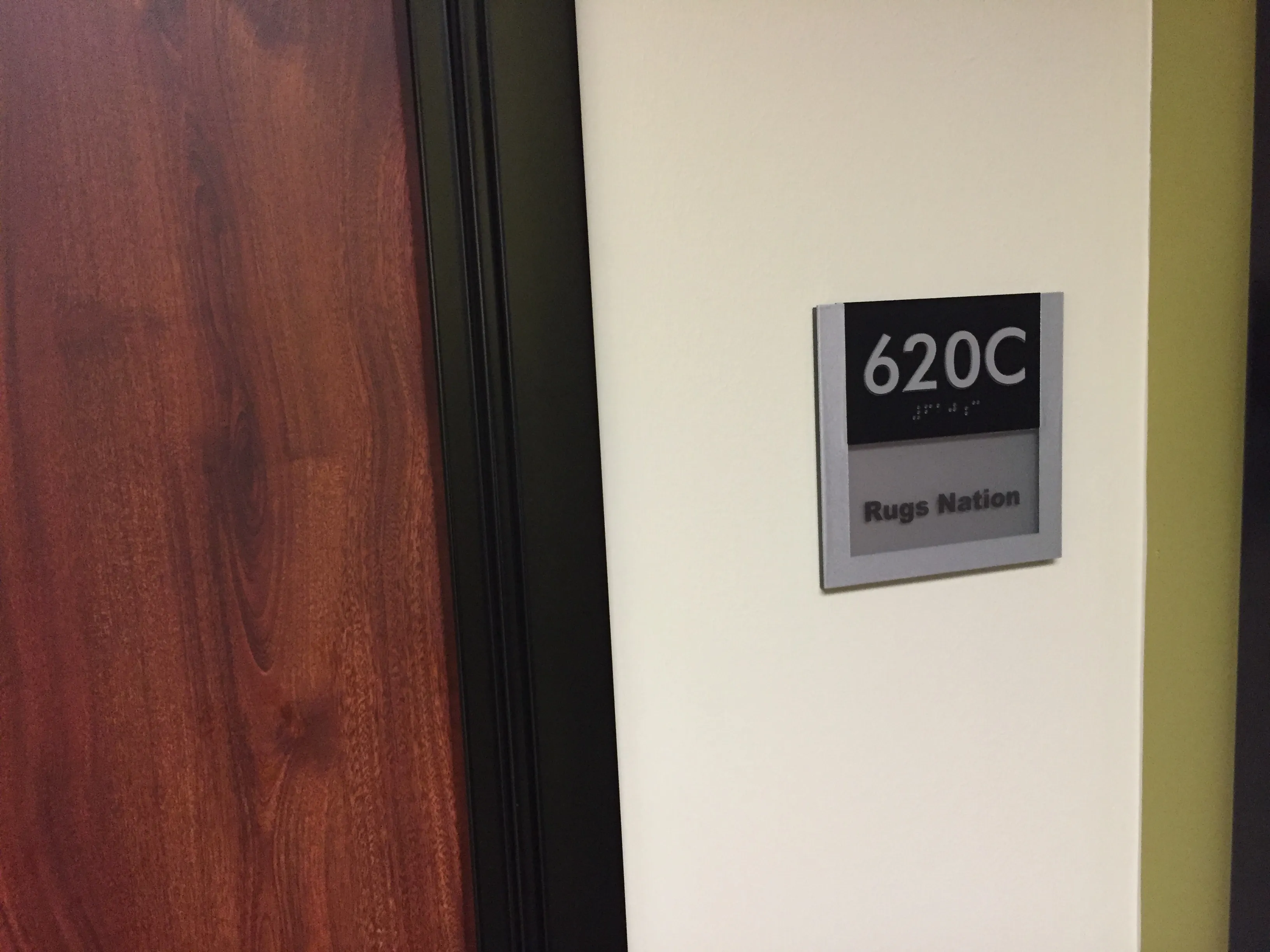 Rugs Nation office door sign at suite 620C
